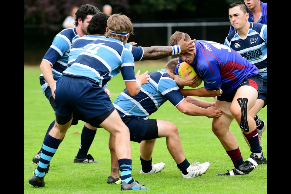 New West Record photographer Jennifer Gauthier caught some of the highlights in action – whether at a minor hockey game or a playoff football encounter. Above, players get tied up in search of the ball during a Div. 2 rugby game at Hume Park.