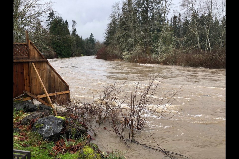The rapidly rising Little Qualicum River, swollen by heavy rains, floods Cedar Grove RV Park and Campground in Qualicum Beach on Thursday.