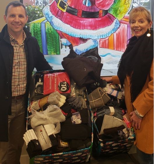Local Realtors Wes Goss and and Patti Goss recently collected socks to be dispersed to folks involved with programs offered by the Lookout Society.