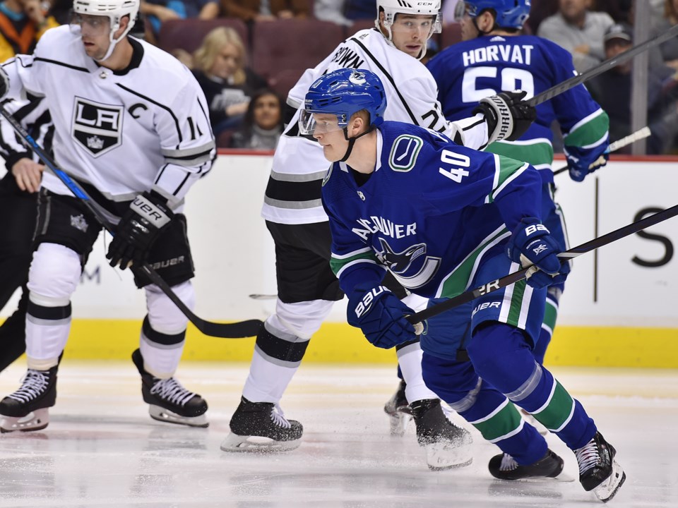 Elias Pettersson tracks down the puck for the Vancouver Canucks against the Los Angeles Kings.