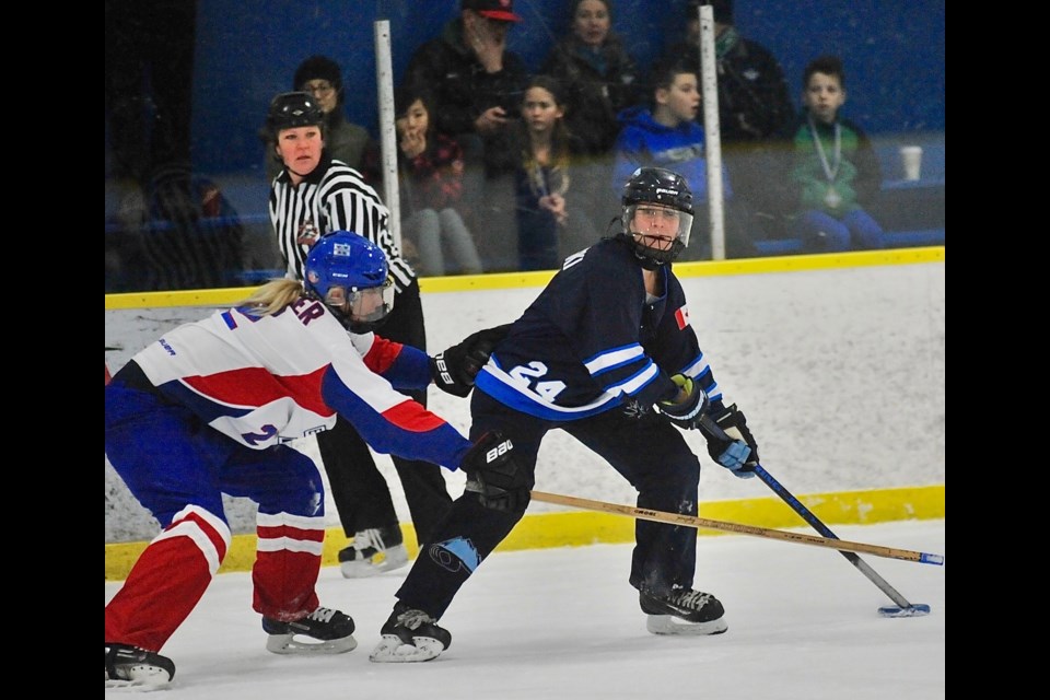 BC Thunder's Kerri Ann Tyschinski looks for an open teammate during Sunday morning's National Ringette League game against the Edmonton Wam! at the Richmond Ice Centre. BC rallied late for a 6-5 win.