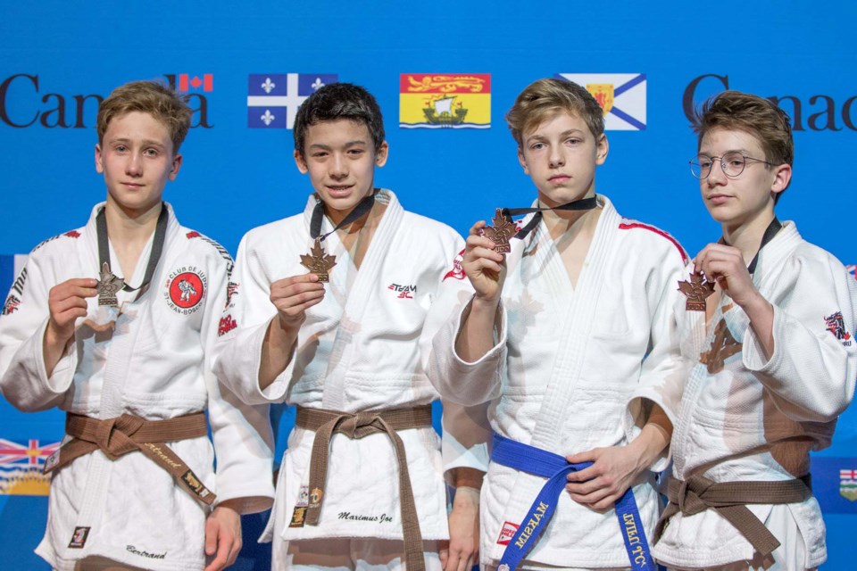 Burnaby Judo Club's Maximus Joe, second from left, marks his victory at the Elite 8 Canada's judo championships with is fellow medalists. Joe topped the u18 50kg division.