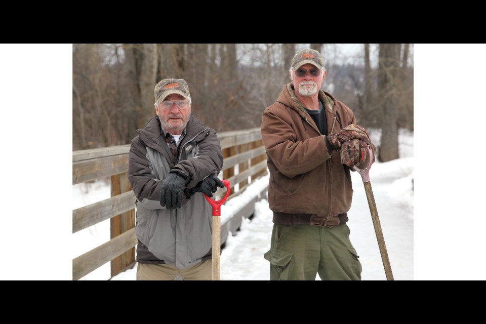 Paul Cailleaux and Brock Bailey are volunteers with Ducks Unlimited Canada who spend the winter feeding the ducks at Cottonwood Island Park.