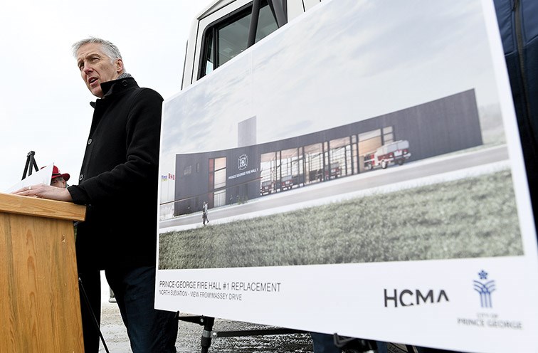 Architect Stuart Rothnie speaks while standing next to an artist's rendition of the new Fire Hall #1 during an unveiling Wednesday of the concept design.
