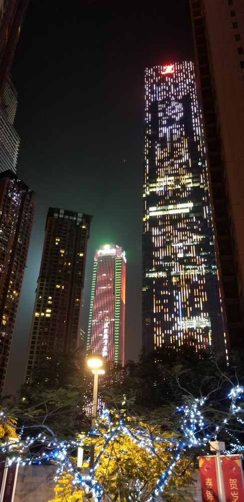 At night, many office buildings are lit up like giant TV screens. Photo Michael Geller