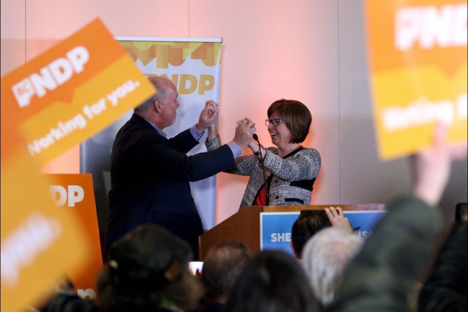 NDP candidate Shiela Malcolmson celebrates with Premier John Horgan after winning the byelection in Nanaimo on Wednesday, Jan. 30, 2019.
