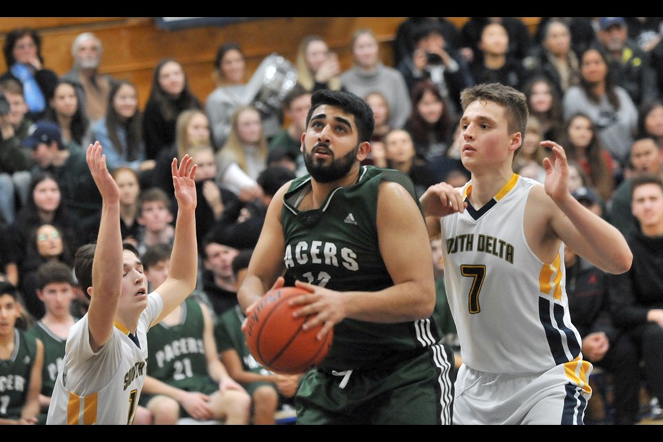 Delta Pacers Ajvir Hothi goes to the basket for two of his 13 points in his team's 64-51 win over South Delta on Friday night in the annual Stebbings/Murray Cup rivalry game.