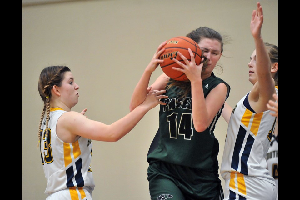 Delta Pacers' Abbey Wigglesworth battles her way to the basket in her team's win over South Delta Friday night to 3-peat as Brasnett/Lawrence Cup champions.