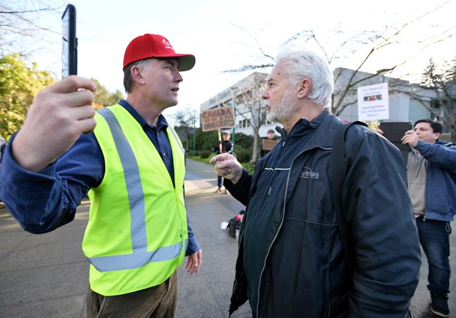 National Citizens Alliance founder Stephen J Garvey faces off with Burnaby’s Alan Dutton, who leads the Canadian Anti-Racism Education and Research Society, on Saturday at Burnaby city hall. Photo: Jennifer Gauthier