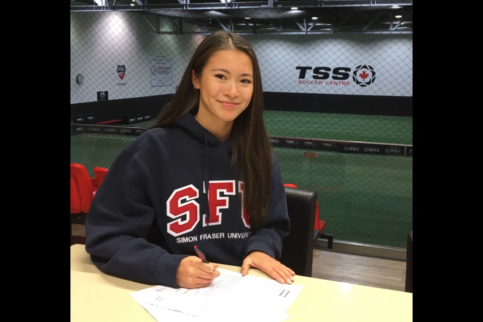 Cariboo Hill's Amanda Scott signs her letter of intent to play and study at Simon Fraser University.