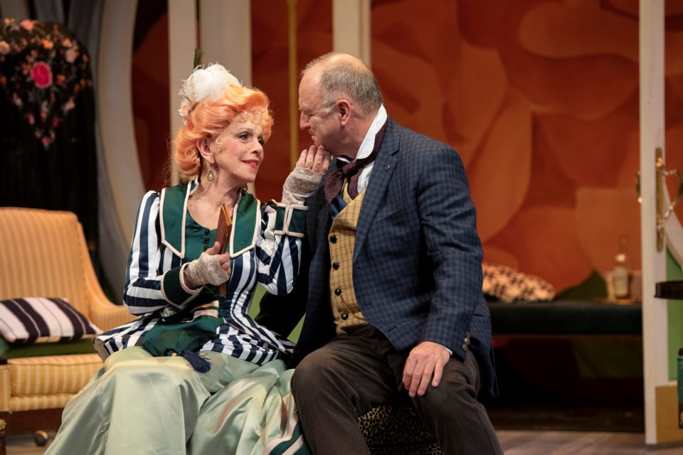 Nicola Lipman and Ric Reid in the Arts Club production of The Matchmaker. (Set and costume design by Drew Facey and lighting design by John Webber.)