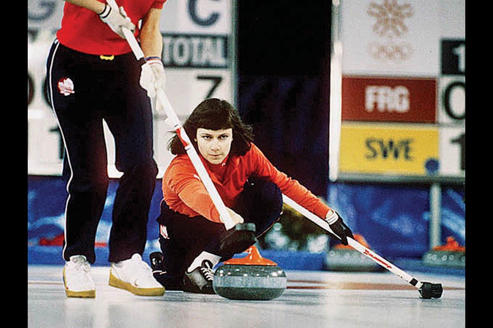 North Vancouver's Linda Moore throws a rock during the 1988 Winter Olympic Games in Calgary. Moore’s rink won gold in the demonstration sport. photo supplied