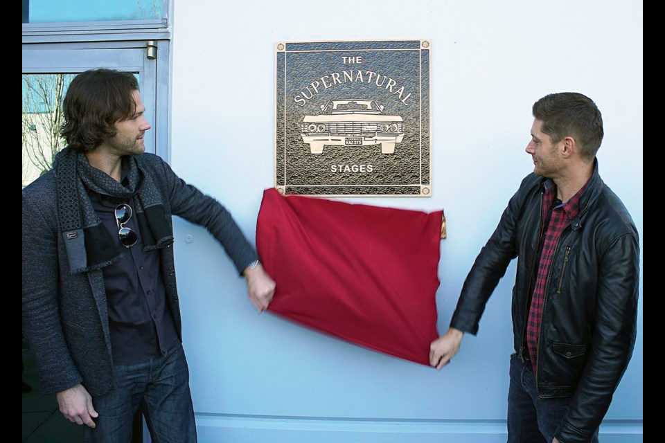 Supernatural stars Jared Padalecki, left, and Jensen Ackles unveil a plaque commissioned by Canadian Motion Picture Park president Alec Fatalevich to commemorate the show’s 300th episode, which aired Feb. 7. The Warner Bros.’ TV series has been filming at the Burnaby studio since it premiered in 2005. The plaque hangs at the main entrance to the studio.