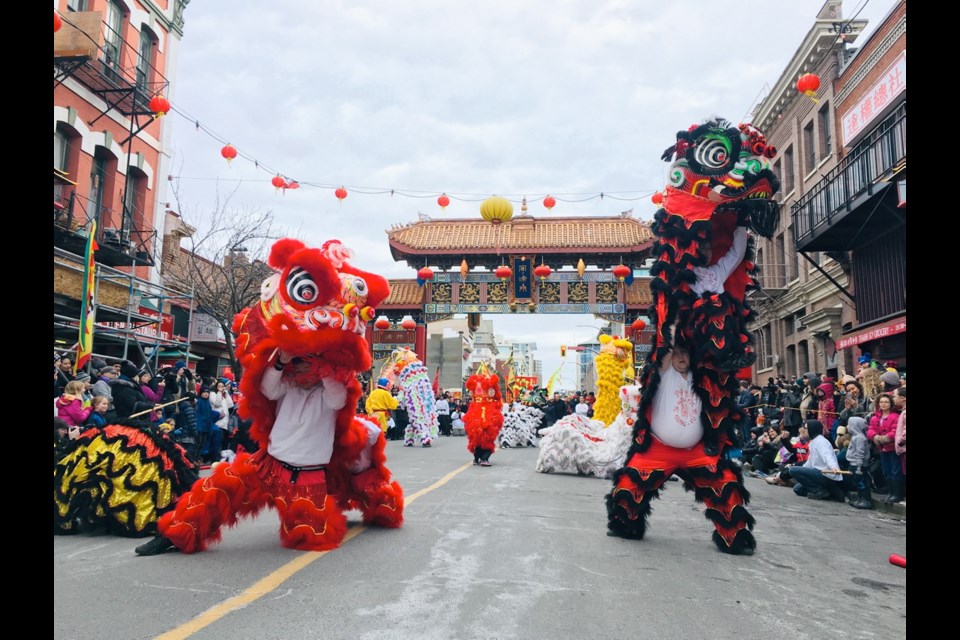 Colourful parade proceeds on Fisgard Street near Gate of Harmonious Interest during Chinese Lunar New Year celebrations on Sunday.