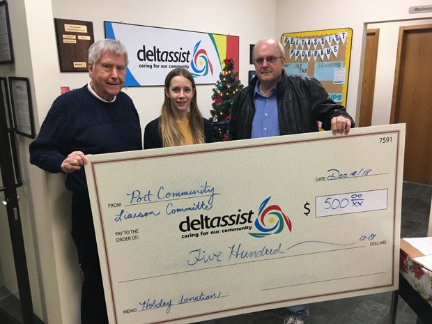 Deltassist Family and Community Services representative Kirsti Korber receives a cheque for $500 from Port Community Liaison Committee members Dennis McJunkin (left) and Mark Gordienko (right).