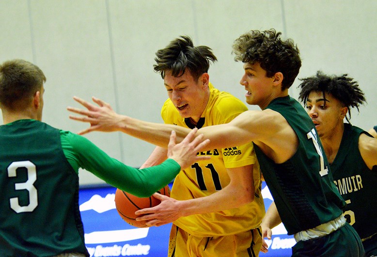 Burnaby South's Aidan Wilson, at centre, shown during the season-opening Tsumura Invitational, will be one of the team's big pieces as it heads into the 4-A Lower Mainland senior boys basketball tournament next week.