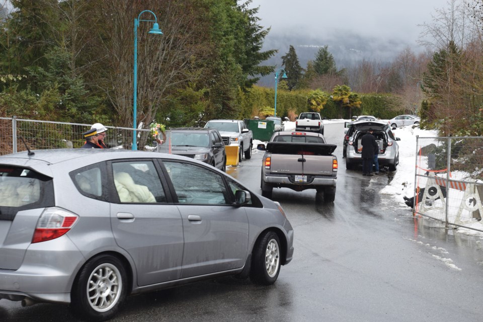 The few remaining residents leave Seawatch on Friday, Feb. 15 as District of Sechelt crews get ready to close and lock a security fence behind them.