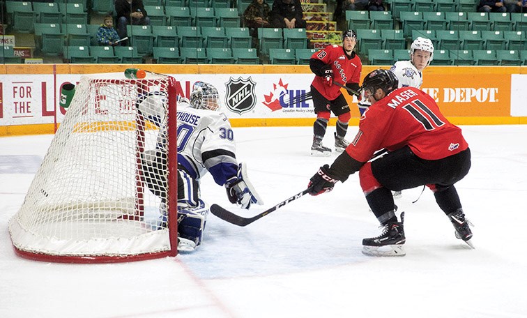 Josh Maser tips a pass from Ethan Browne in behind Victoria Royals goalie Griffen Outhouse to score a power-play goal in the second period of Saturday's game at CN Centre. The Roylas won in a shootout, 5-4.