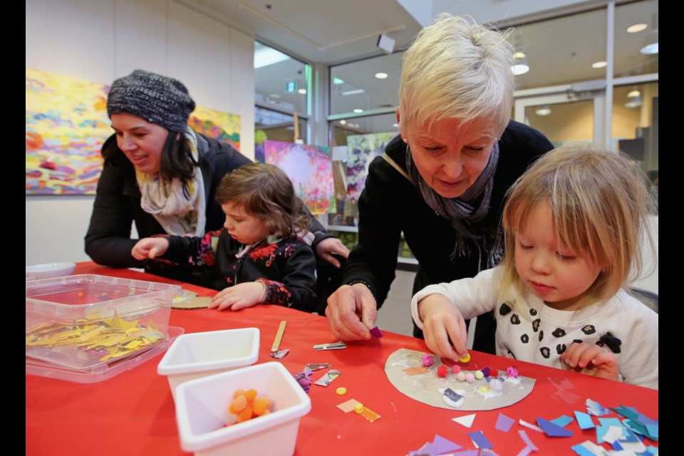 Monique Cotton, left, with daughter Emily take in the craft table alongside Alex Spicer and her granddaughter Madison during Family Day celebrations at Cedar Hill Recreation Centre. Feb. 18, 2019