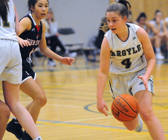 Argyle's Holly Brewer drives to the hoop during a game last week. Brewer hit nine three pointers to lead the Argyle Pipers to victory over McMath in the Crehan Cup Lower Mainland Championship final Saturday at Lord Byng Secondary. photo Cindy Goodman, North Shore News