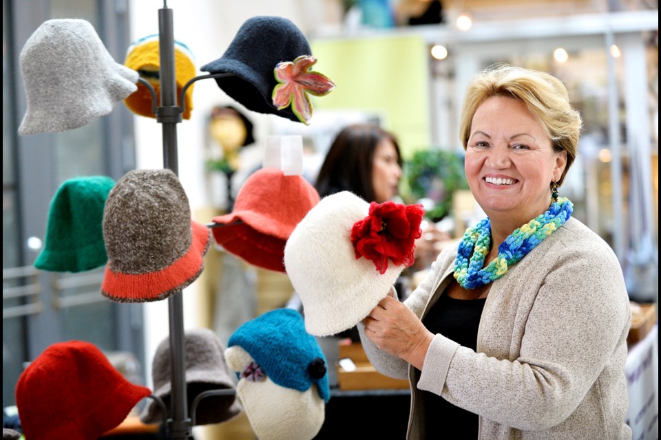 Rafa Jerkovic of Bela Hats shows off some stylish creations at the Feb. 16 New West Craft market.