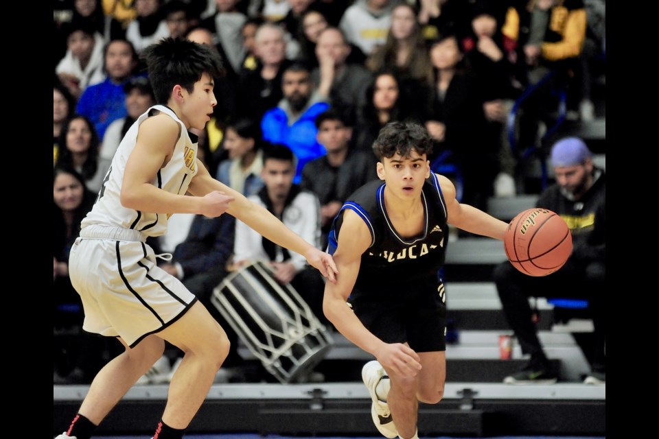 McMath's Travis Hamberger drives to the basket during Tuesday's title game at the BC Junior Boys Invitational Basketball Championships. Hamberger was terrific in leading his team to a second place finish in the 32-team event, earning first team all-star honours.
