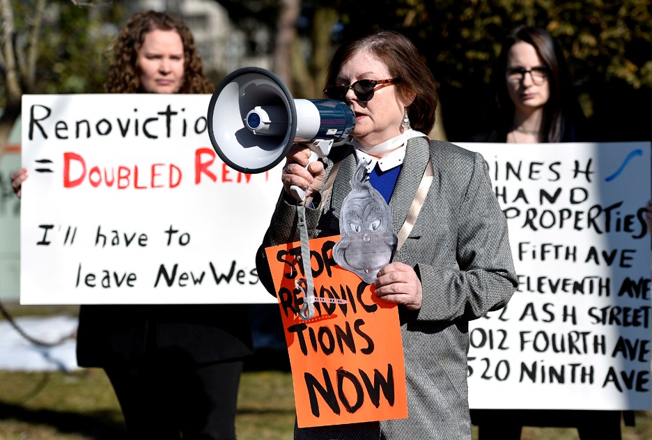 Shelley Outhwaite speaks in front of her home at 732 - Fifth Ave. in New Westminster during a rally after tenants were told they will have to move out due to renovations. JENNIFER GAUTHIER PHOTO