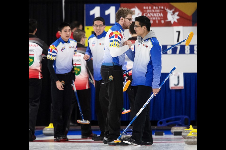 Team BC, that includes skip Hayato Sato, from Coquitlam, and Port Coquitlam's Joshua Miki, as well as Dawson Ballard and Troy Chong, celebrates their 7-2 win over Ontario in the gold medal match at the Canada Winter Games curling competition.