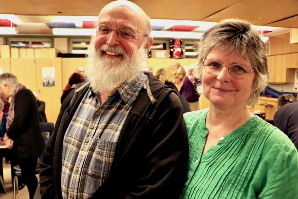 Composer and writer Brian Hoover poses with conductor Alison Nixon during a rehearsal break.