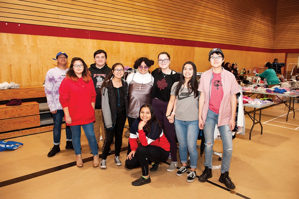 Students from the Squamish Nation youth leadership group Menkis, which means travel in the Squamish language, held a garage sale at Totem Hall on Saturday to raise money for their next trip.
