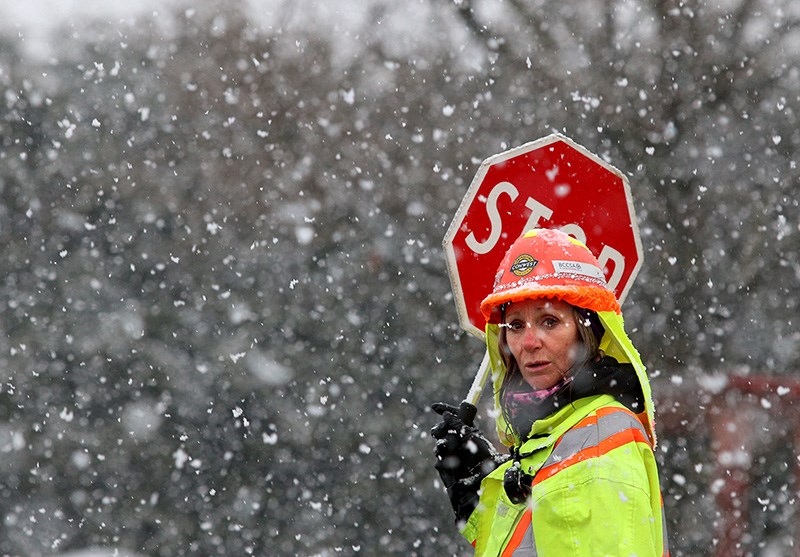 MARIO BARTEL/THE TRI-CITY NEWS Llyn Lindo, a traffic controller on Kingsway Avenue at the site of t