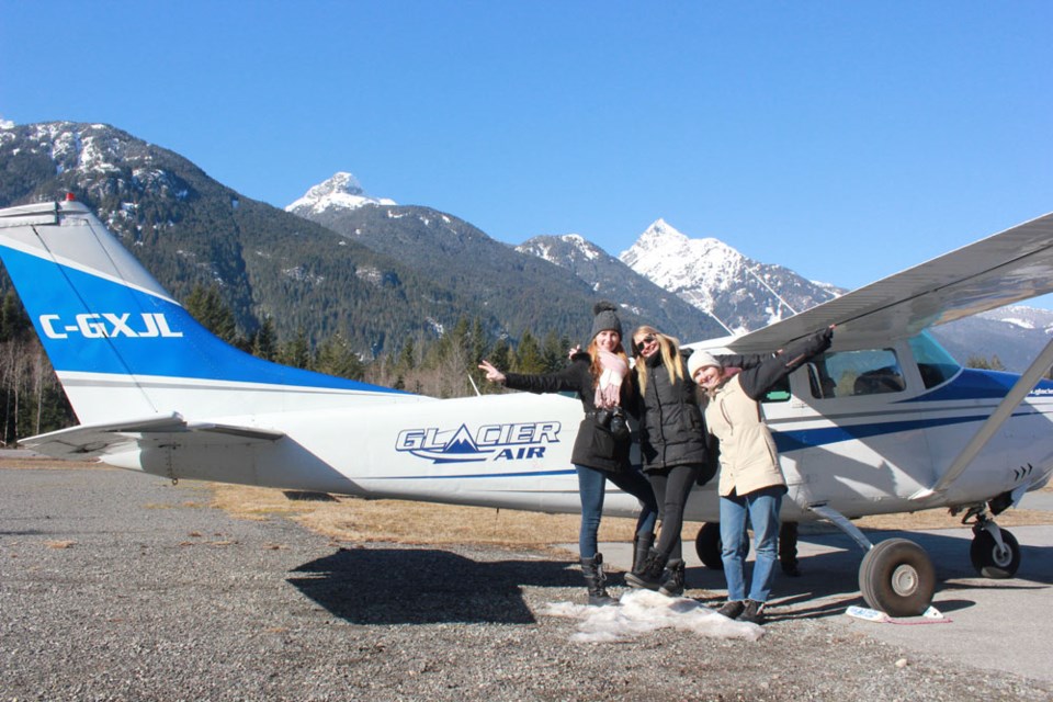 The first group of passengers get ready for the first free flight of the day on March 9. Glacier Air in Squamish offered free rides to women and girls who had never flown in a small plane before, as part of the International Women of Aviation Week.