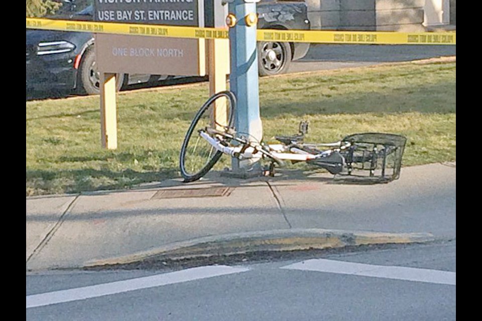 A bicycle lays on the sidewalk at Coronation Avenue and Richmond Road in Victoria on Wednesday, March 13, 2019. Police weren't sure what happened in the collision, which sent a cyclist to hospital with non-life-threatening injuries.