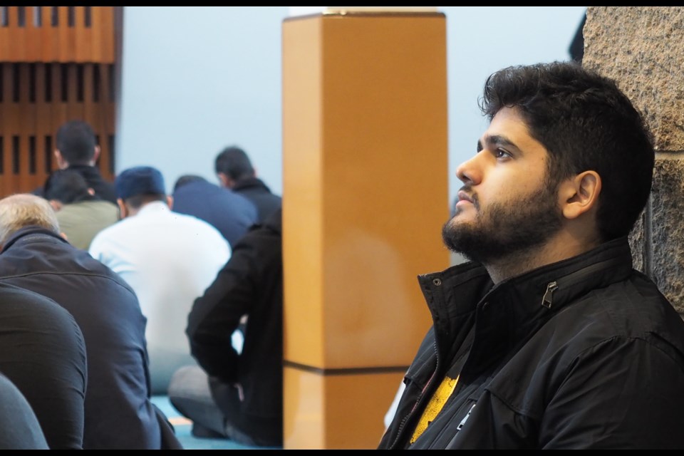 A worshipper listens during Friday prayers at a mosque in Port Coquitlam.