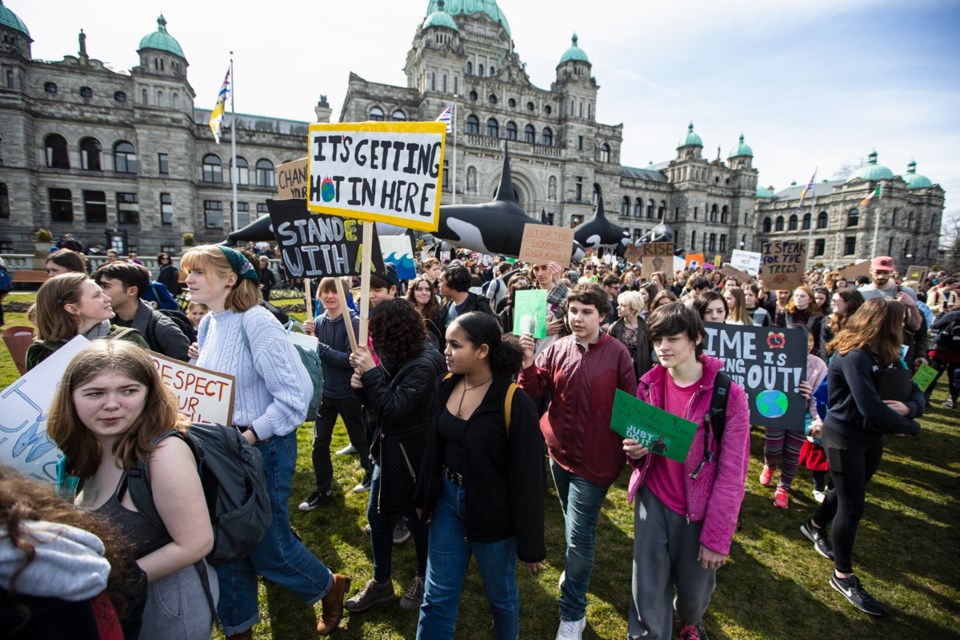 Students and supporters gather as part of a climate change protest at the legislature on Friday, March 15, 2019.