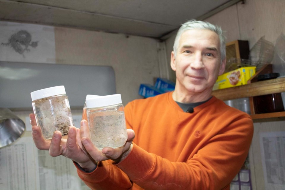 Scientist Gennady Kantakov with plastic samples taken from the Gulf of Alaska.