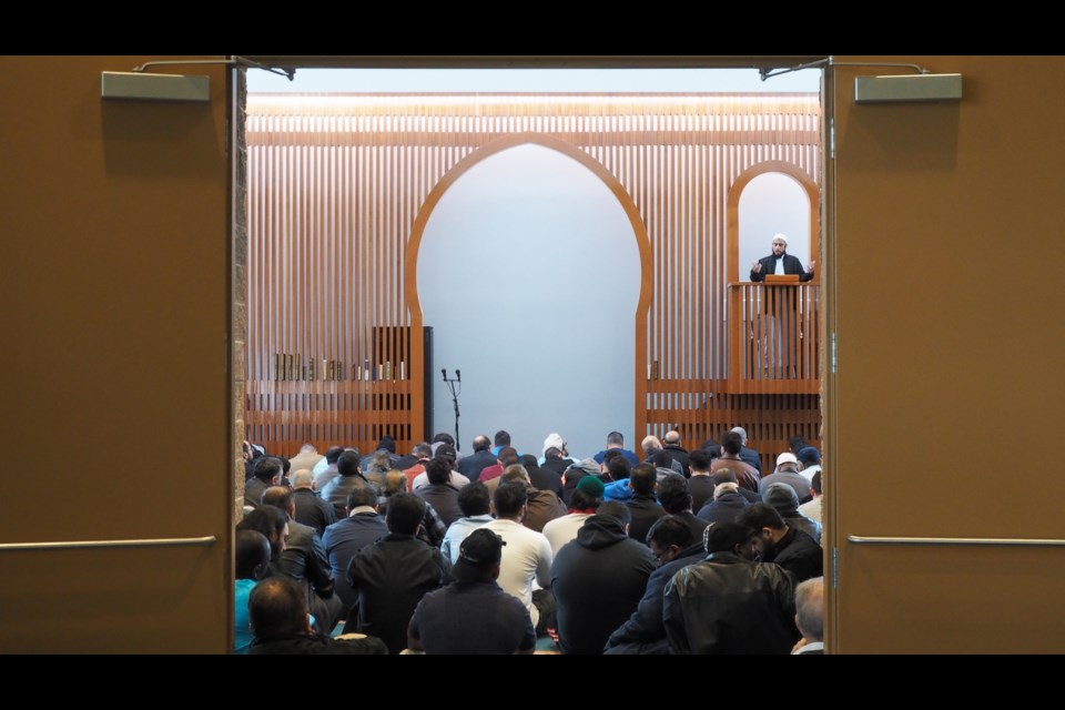 A worshipper listens during Friday prayers at a mosque in Port Coquitlam.