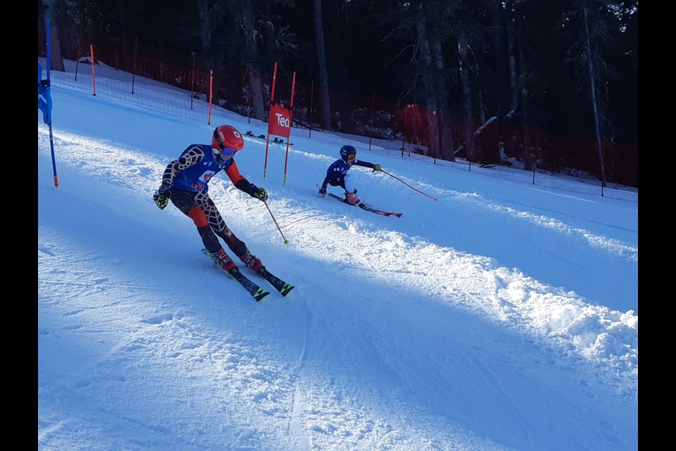 Cordelia Hultman of Grouse Mountain Ski Club, right, takes on another racer in the dual slalom team event at the Teck under-14 provincial alpine skiing championships two Sundays ago at Purden Mountain Ski Resort.