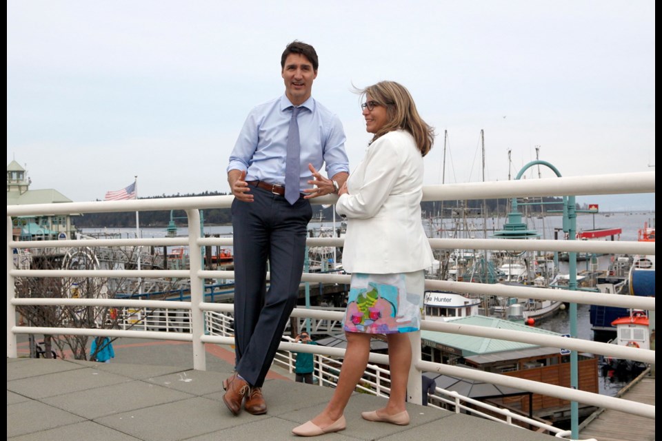 Prime Minister Justin Trudeau chats with Liberal candidate Michelle Corfield after greeting supporters along the Harbourfront Walkway in Nanaimo on Monday. Corfield is running in the federal byelection set for May 6 in Nanaimo-Ladysmith.