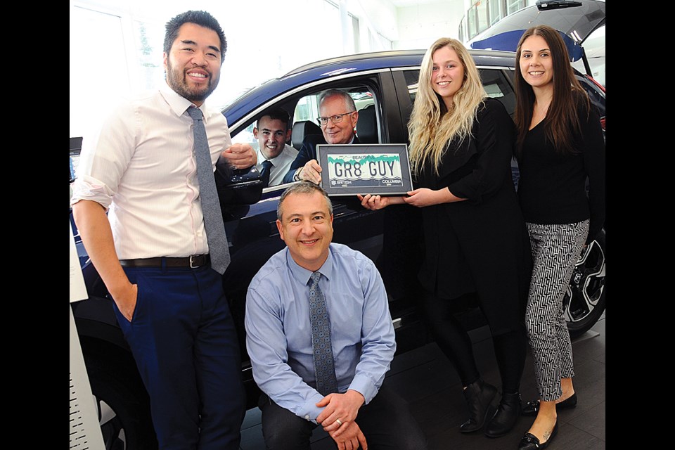 Jack Irwin (driver’s seat) – shown here with Dick Irwin Group teammates Vinh Nguyen, Jordan Milevski, Justin Acheson, Kiah Thorpe and Danika Jimenez – keeps business rolling in the company founded by his father, the original ‘great great guy.’ photo Cindy Goodman, North Shore News