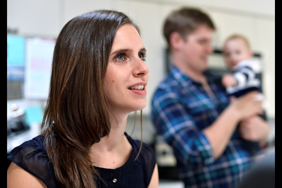 Harriet Ronaghan, recipient of the 2019 Courage To Come Back award in the physical rehabilitation category, at home with her husband Tyler and eight-month-old son Charlie. Photo Jennifer Gauthier