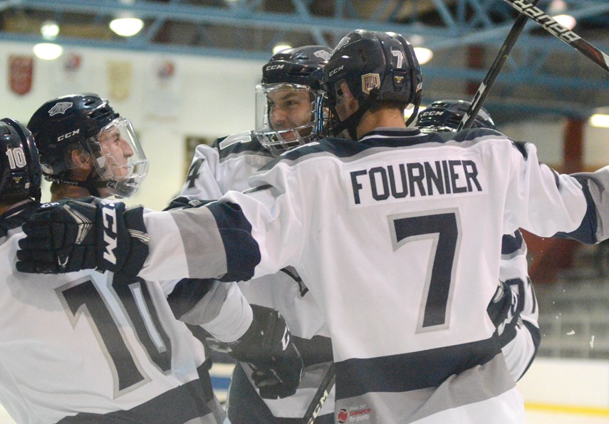 Members of the North Van Wolf Pack celebrate a goal during their PJHL championship series against the Langley Trappers. The Pack swept the series 4-0 to take the league title. photo Paul McGrath, North Shore News