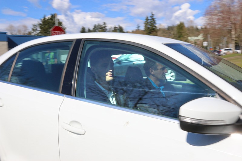 Port Moody mayor Rob Vagramov arrives at city hall on Thursday for an emergency council meeting after he was charged with one count of sexual assault stemming from an incident alleged to have occurred in 2015.