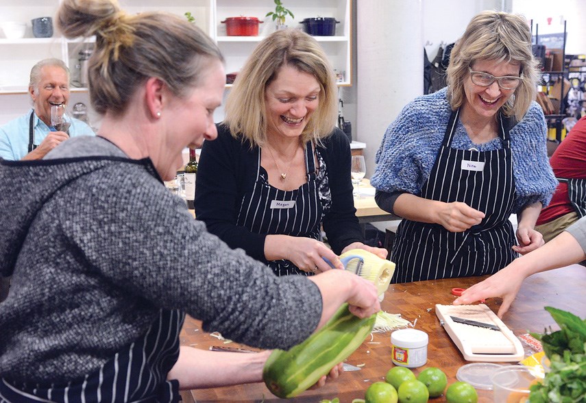Sherry Brewer, Megan Stapelmann and Nina Bratsberg prep ingredients for cooking Pad Thai at Cook Culture on Lonsdale.