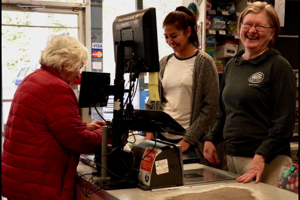 Staff from the General Store, Irksa and Karen, enjoy a chat with a favourite customer. Until April 1, Iskra and Karen were Ruddy Potato-ers.