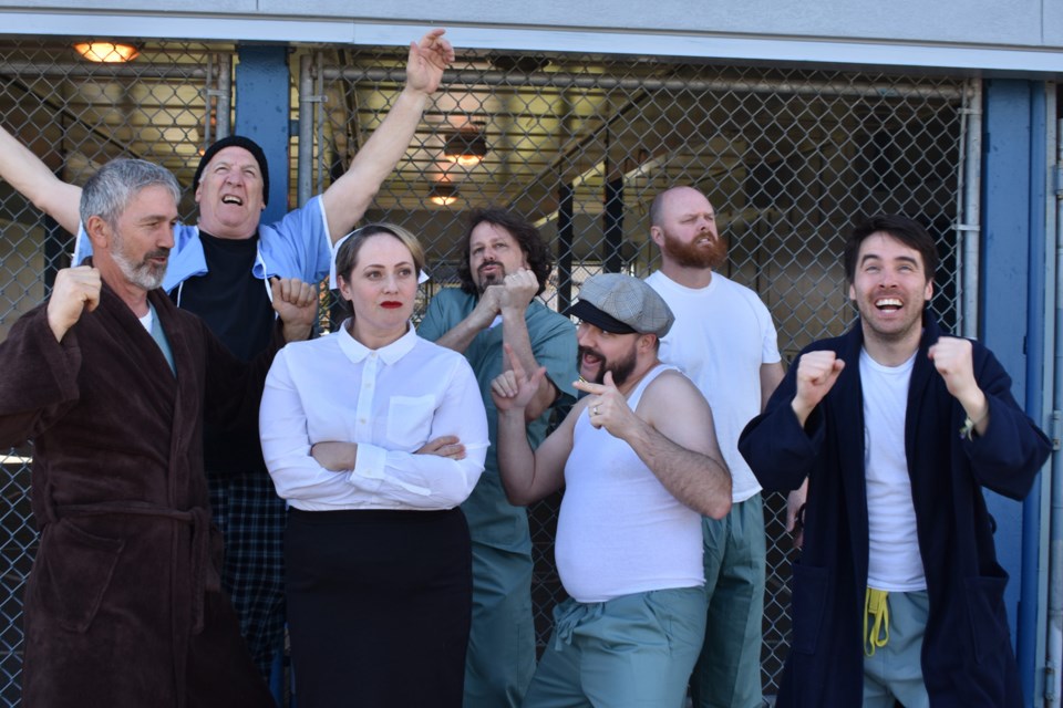 Katherine Morris (Nurse Ratched) is surrounded by patients in One Flew Over the Cuckoo's Nest, the Stage 43 Society production that's onstage at Evergreen Cultural Centre starting May 2.