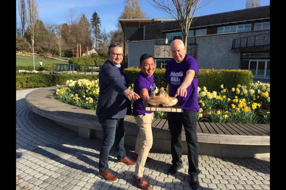 New Westminster Coun. Chuck Puchmayr, Dr. Davidicus Wong and Burnaby Mayor Mike Hurley, from left, took part in the April 2 launch of the Walk30 Burnaby/New West walking challenge - where the two cities will try to win the coveted gold shoe trophy.