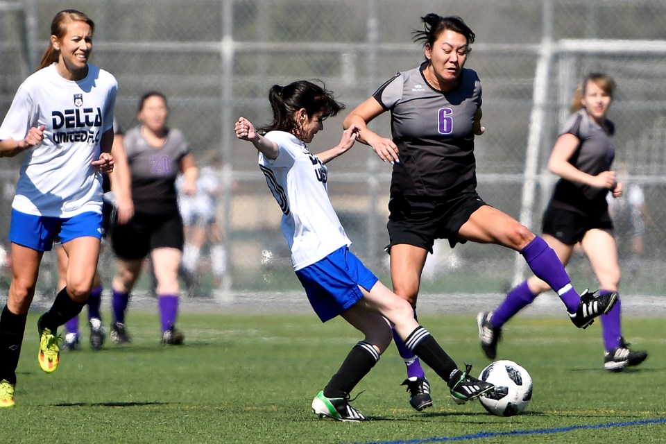 Getting the jump on her Delta rival, New West Rush's Kelly Di Stefano battles for the ball during last week's Metro Women's Soccer League Classic Div. 2 cup final against Delta. The Rush fell 2-1 to Delta.