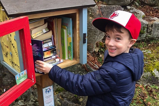 Nolan Dempsey, 7, spent much of his spring break restocking little libraries in Coquitlam and Port Coquitlam.