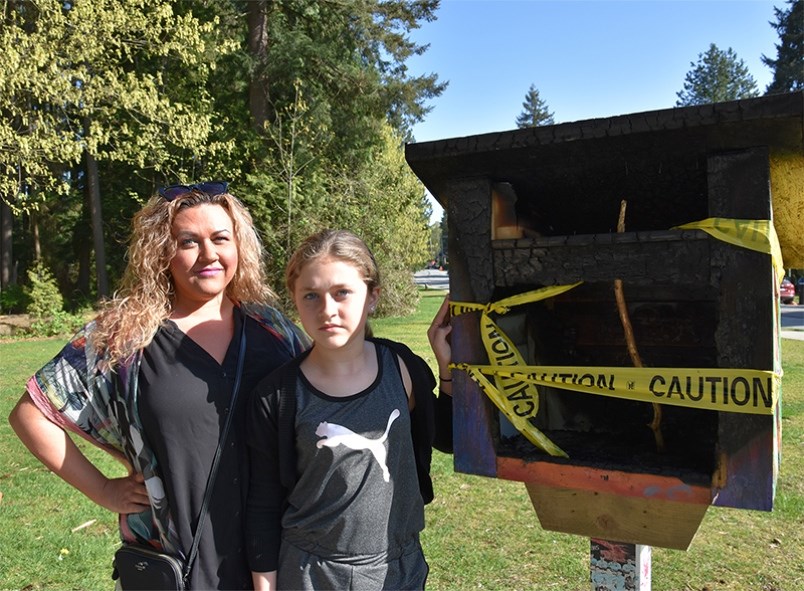 Kyra Gregory and her mom, Amber, were stewards of this Little Free Library at Wellington Park in Por